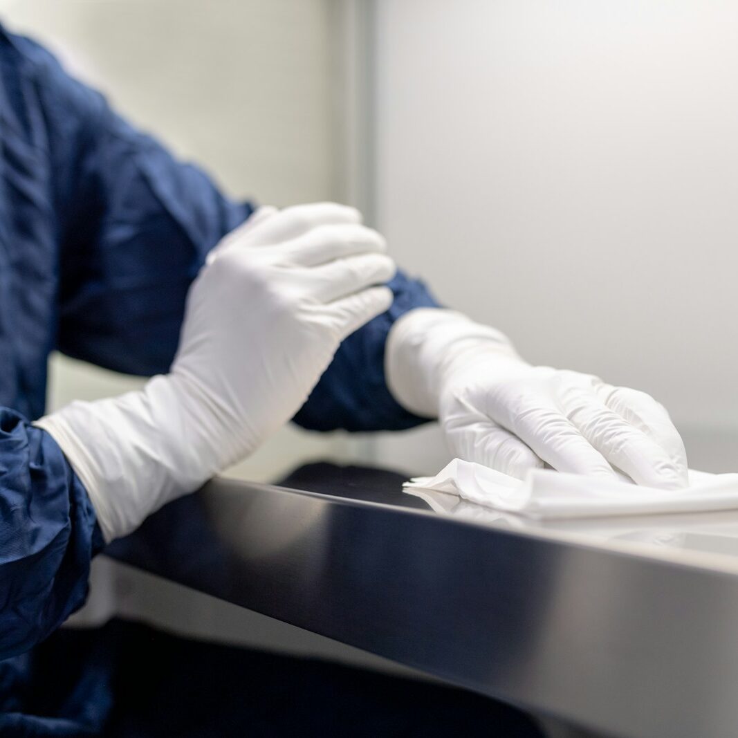 a person wearing gloves and gloves